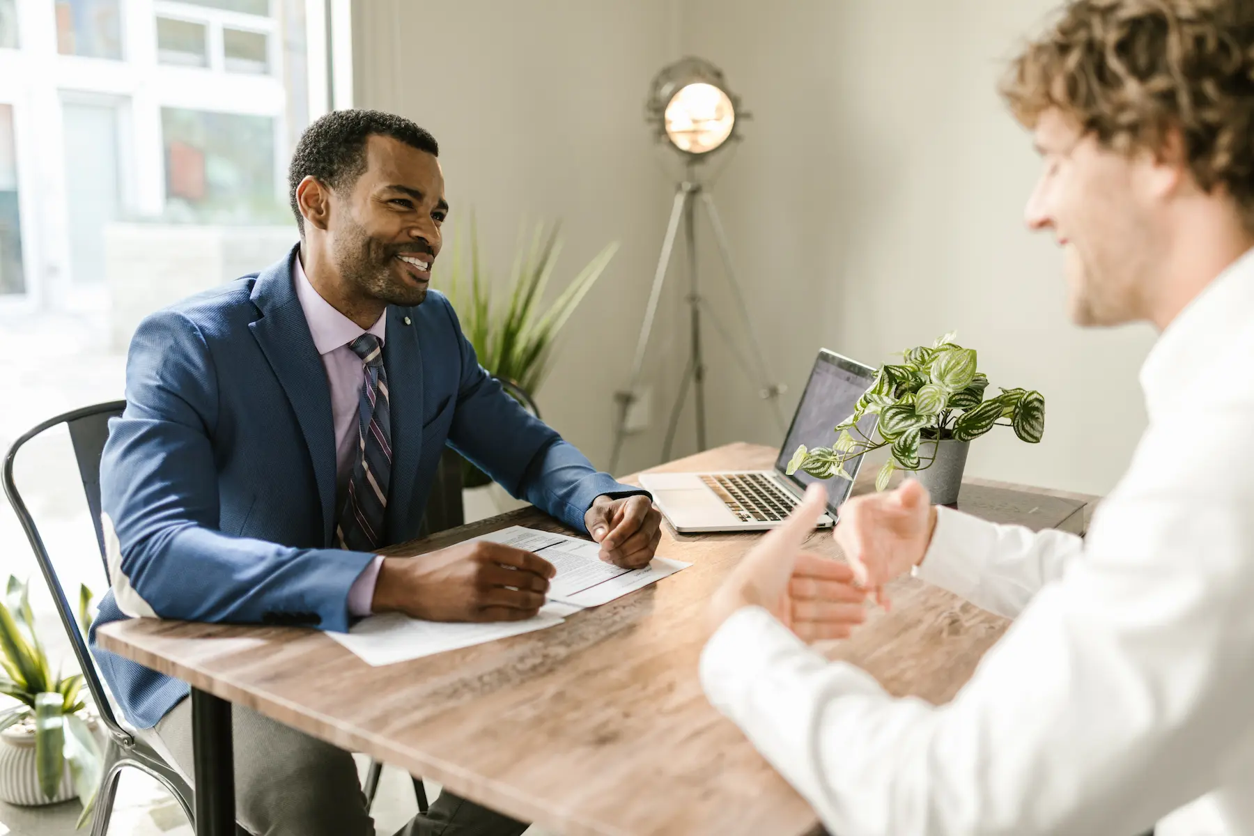 Two people working together at a desk