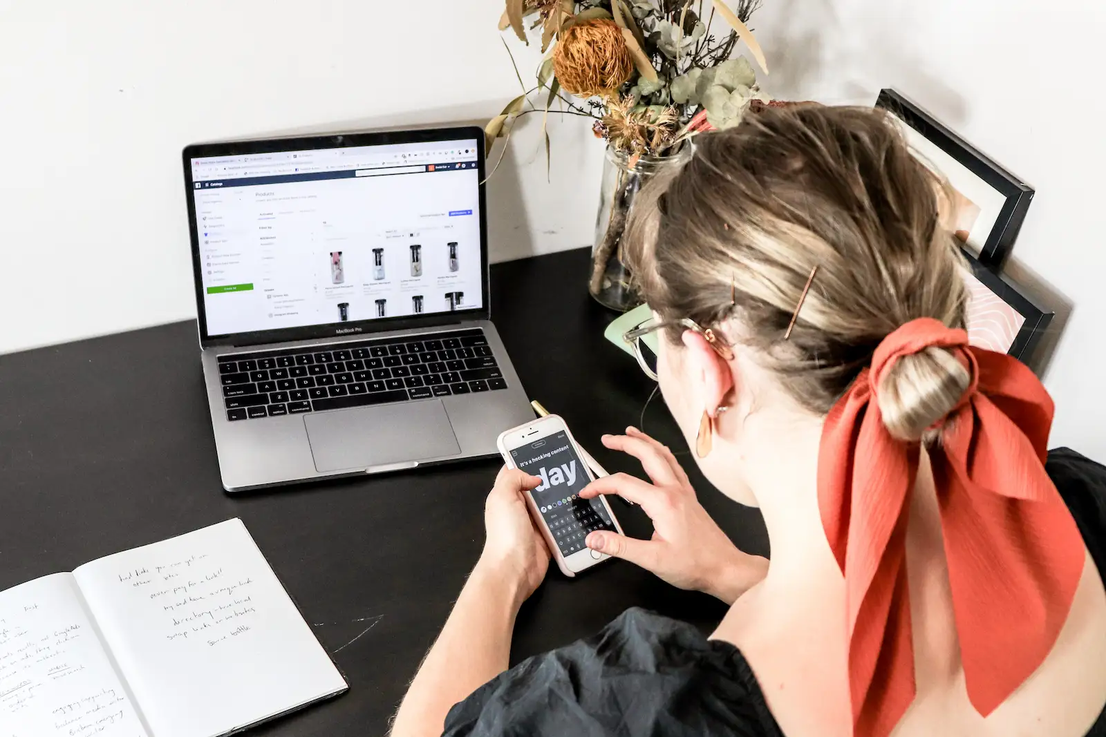 Woman on phone creating a business plan