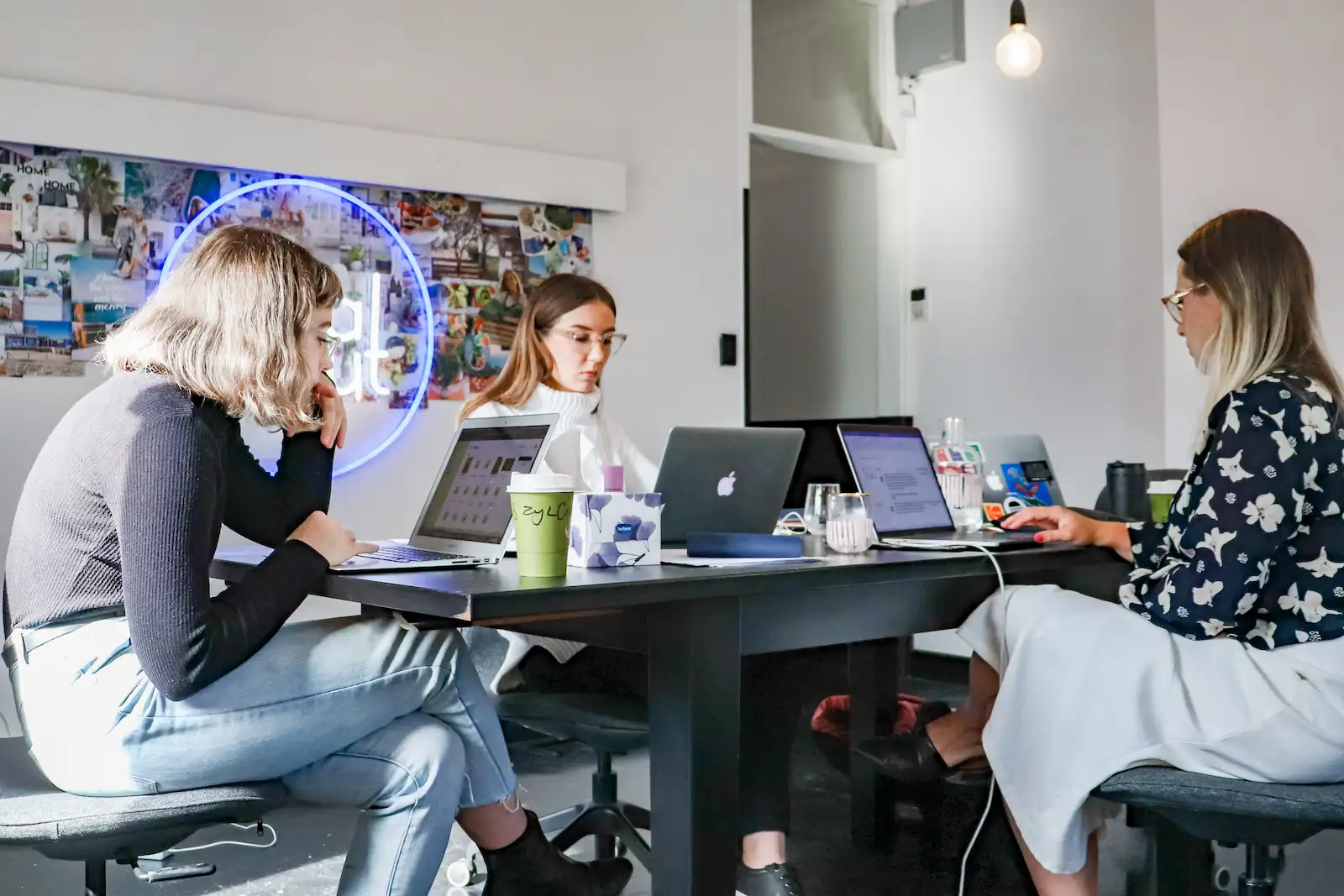 Women working on laptops in a coworking space