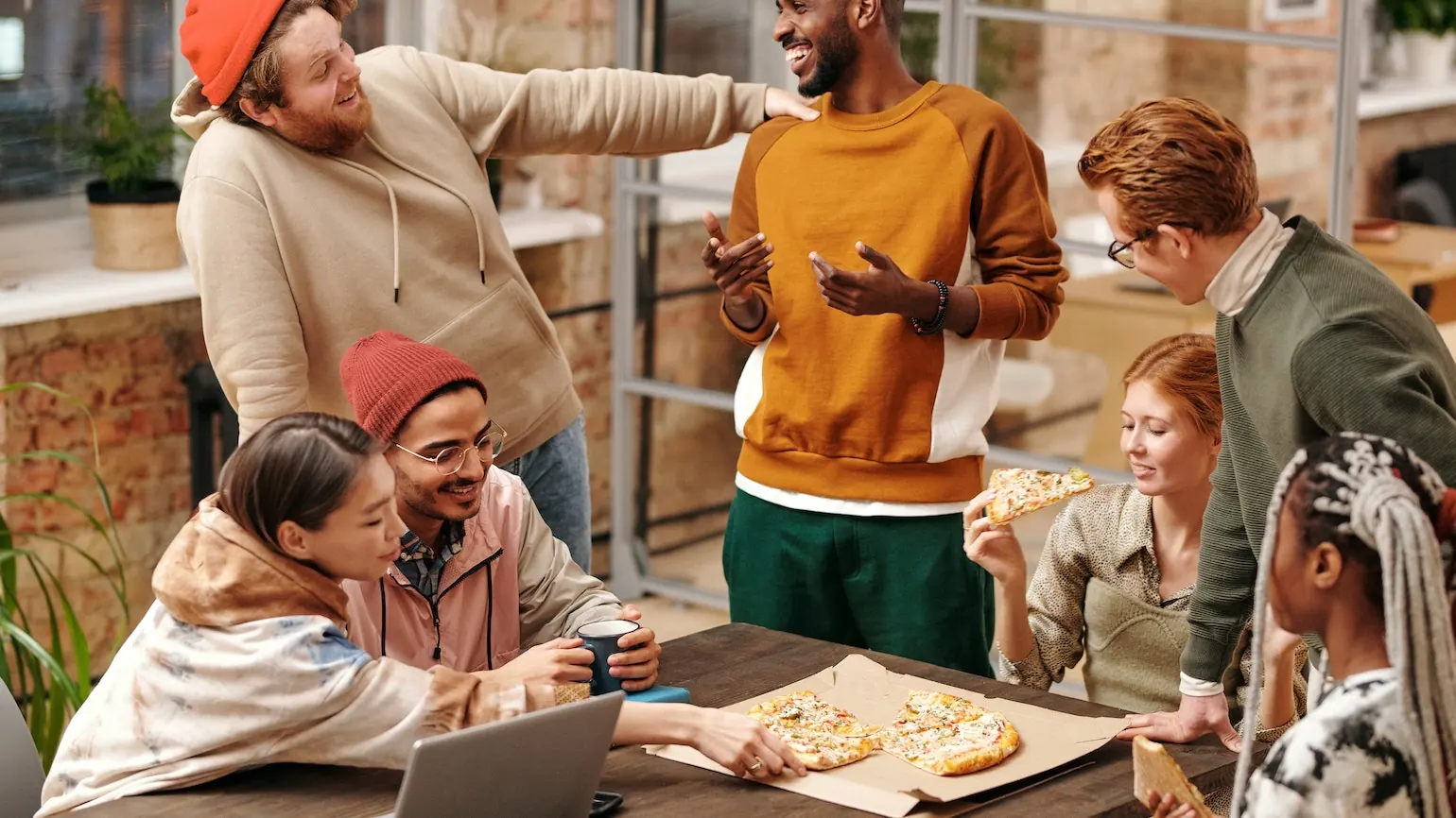 Social events like a pizza party can engage your coworking community