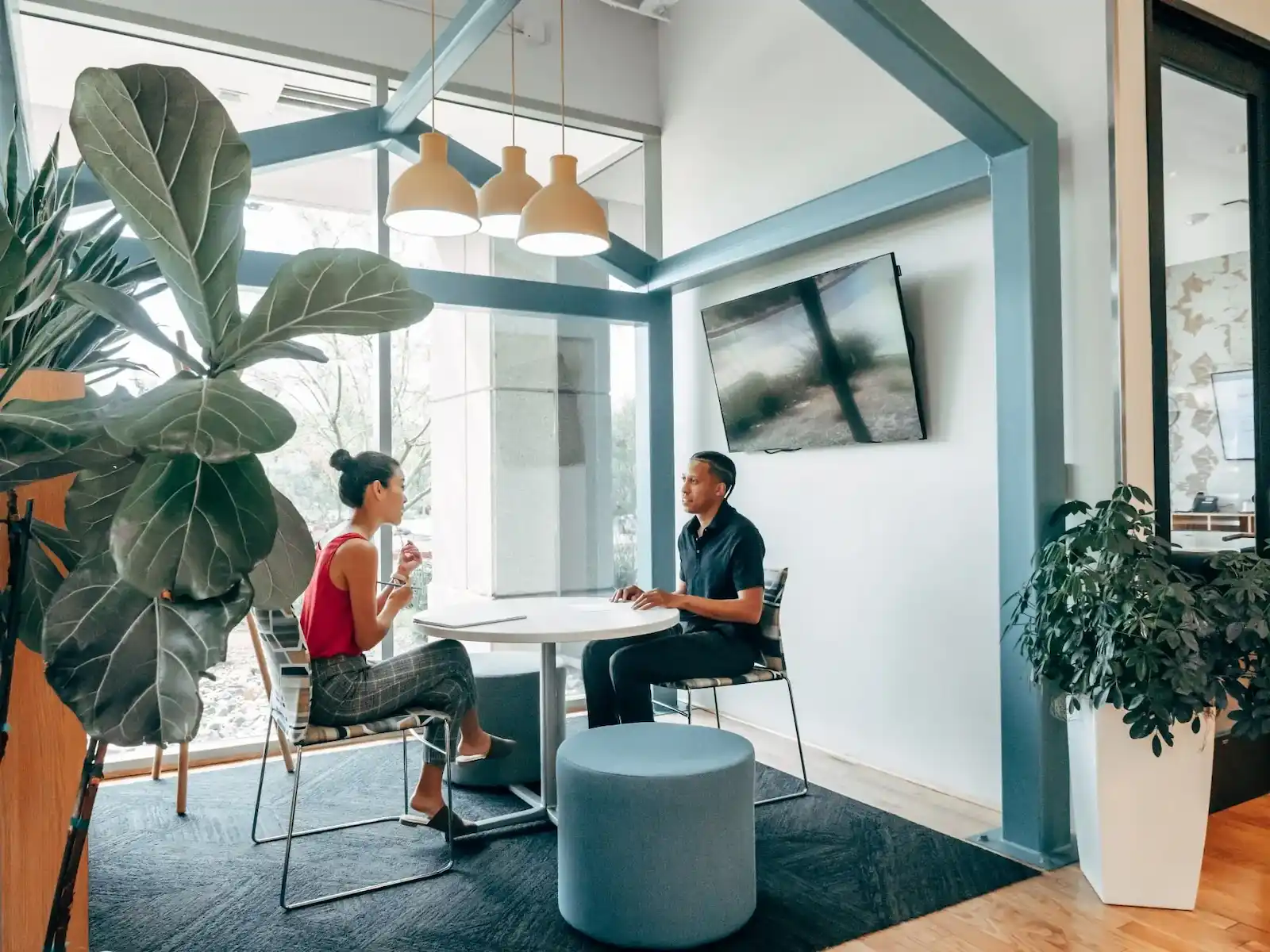 Two people sitting and working in a coworking space