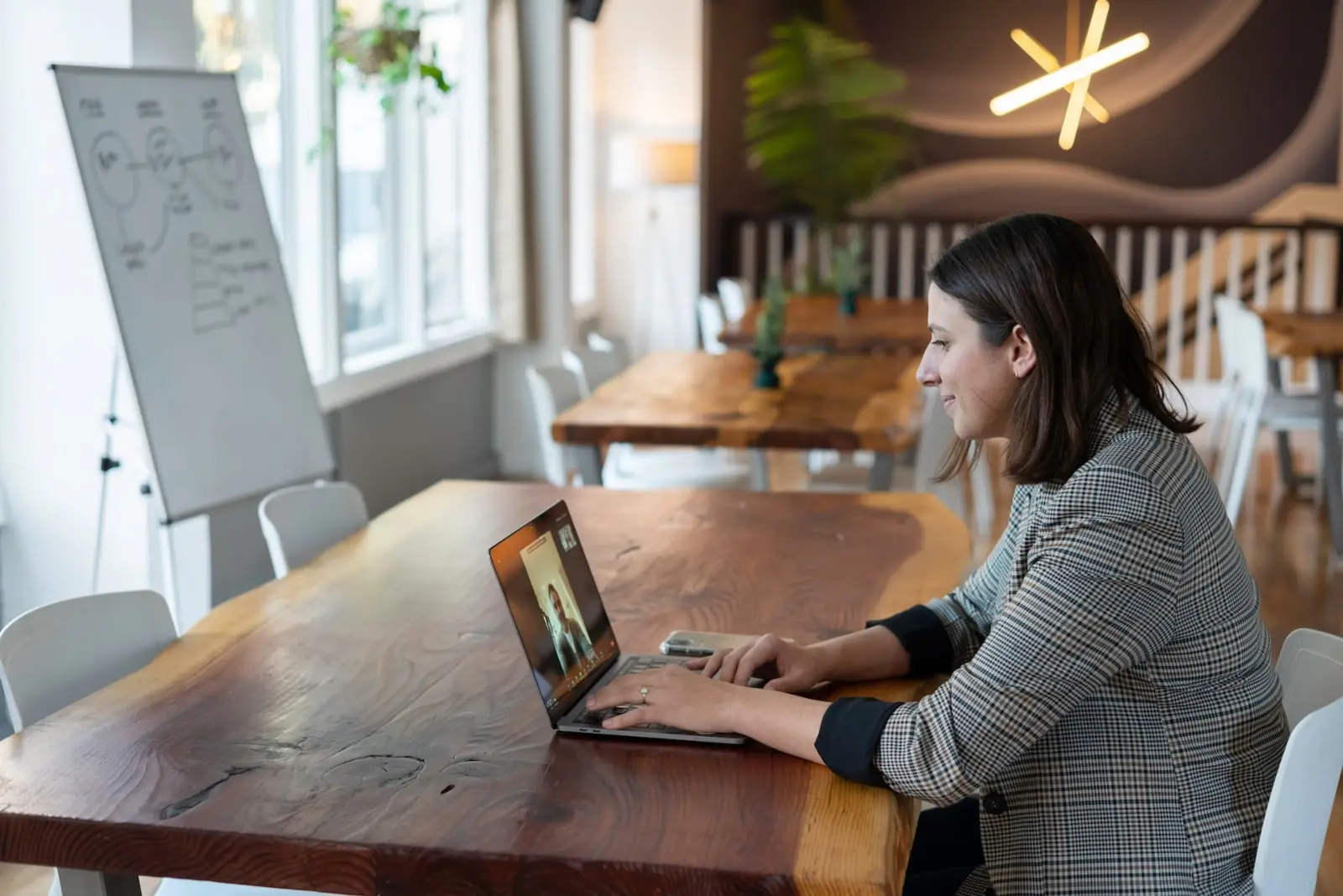 Person working at their desk in a coworking space