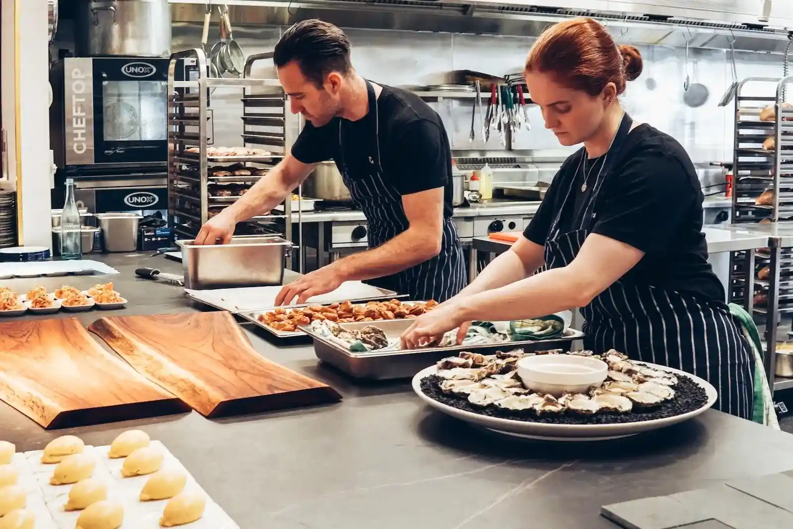 Chefs working in a shared commissary kitchen