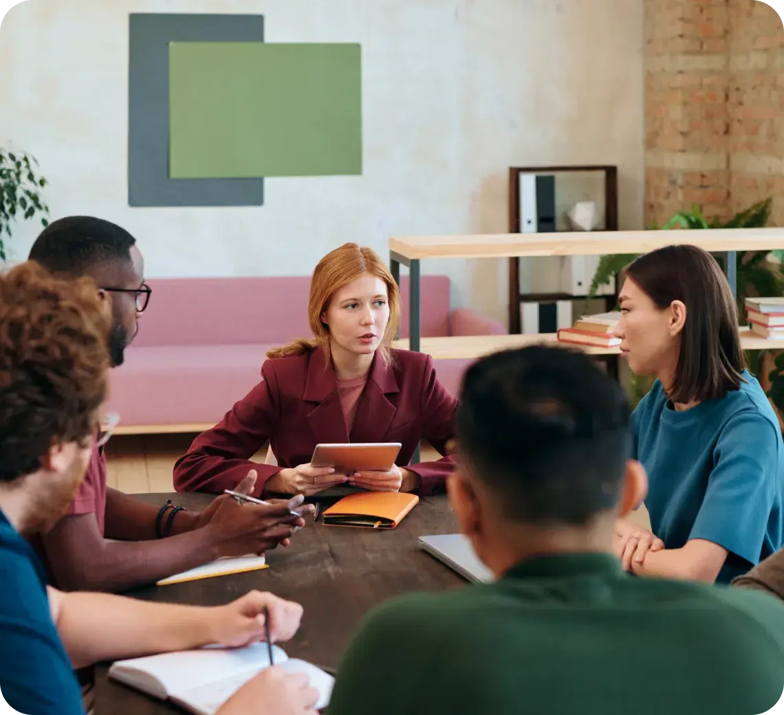 People sitting at a table and collaborating together