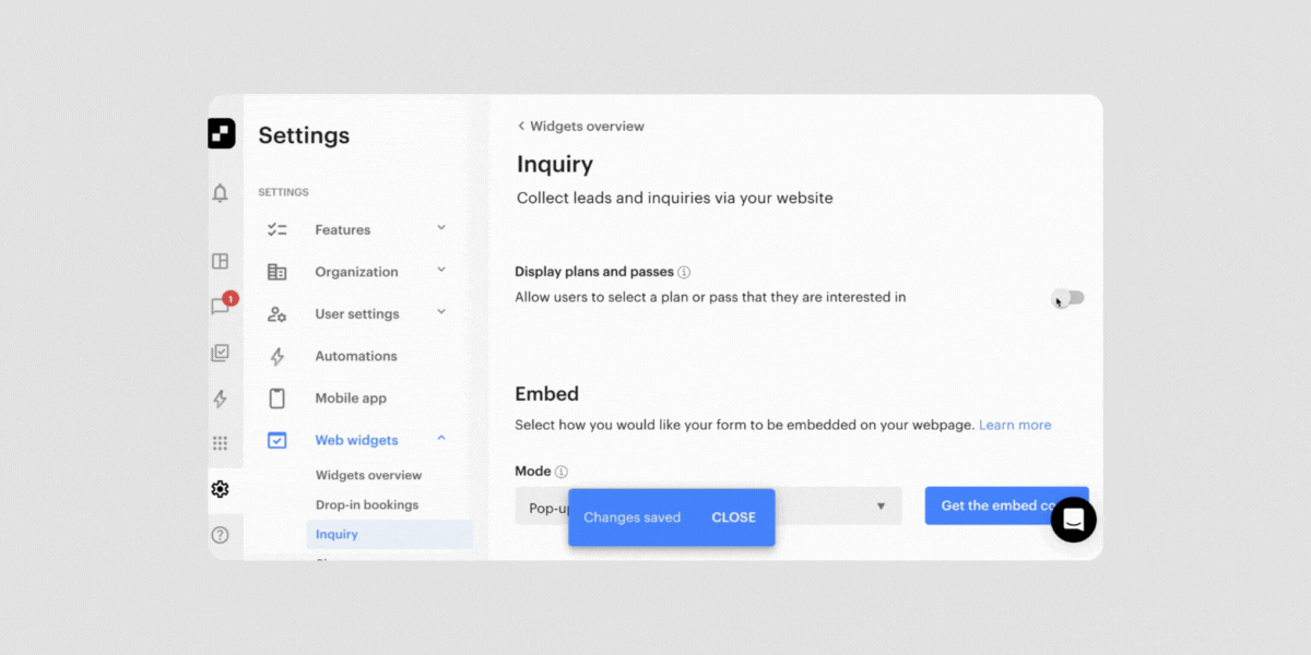 Animated screen recording of the inquiry widget settings within a web dashboard. The admin toggles a setting to display plans and passes, and selects a pop-up mode for the inquiry form.