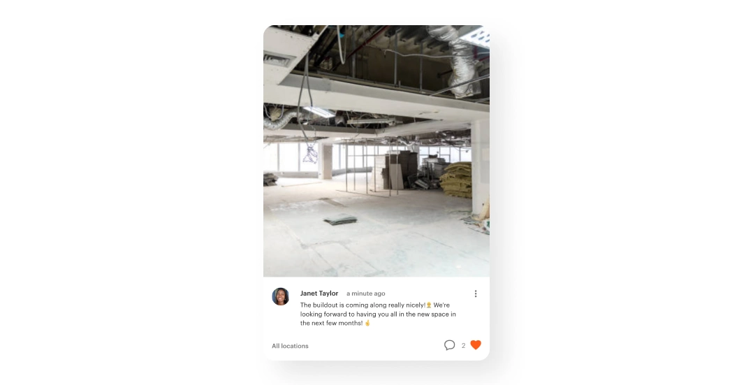A post from Janet Taylor on a community feed showing a photo of a partially constructed coworking space. Exposed ducts and insulation materials are visible. The caption reads: 'The buildout is coming along really nicely! We’re looking forward to having you all in the new space in the next few months!' with two comments and a heart icon.
